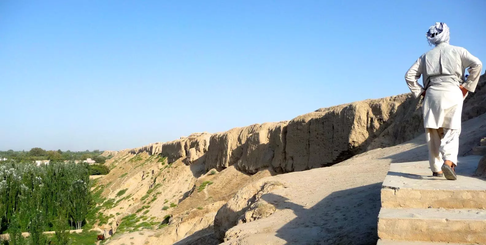 009 blk nafg man walking walls of balkh 50691020762 o